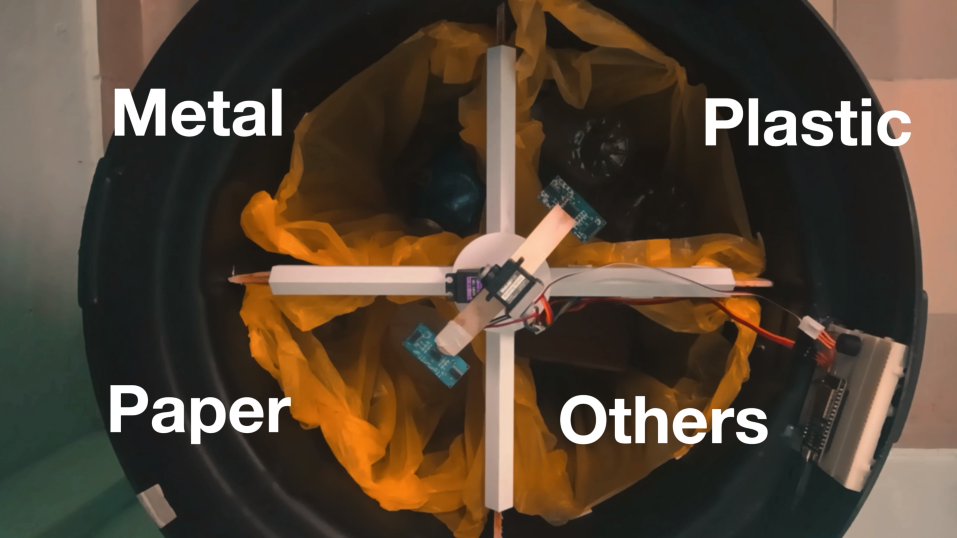 Top-down view of bin interior labeled Metal, Plastic, Paper and Others